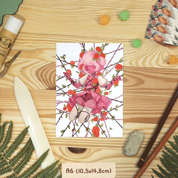Postcard with Pink Diamond from Steven Universe, on a wooden surface with stationery items.