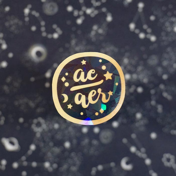 ae aer golden sticker from lgbtq friendly business  with a black background