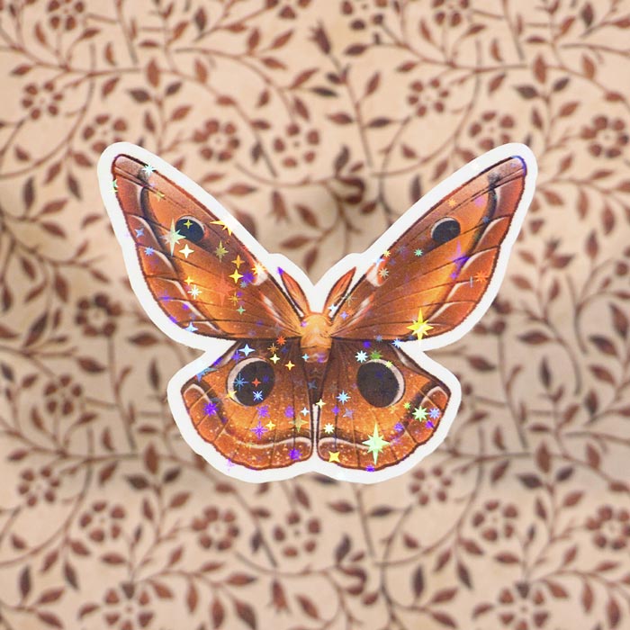 aesthetic sticker representing the waning crescent as a moth on a brown paper with plants made by atelier persephone
