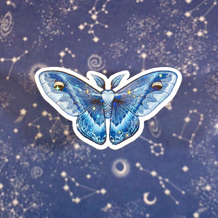 holo sticker waxing crescent blue moth sticker with a starry background by the artist atelier persephone