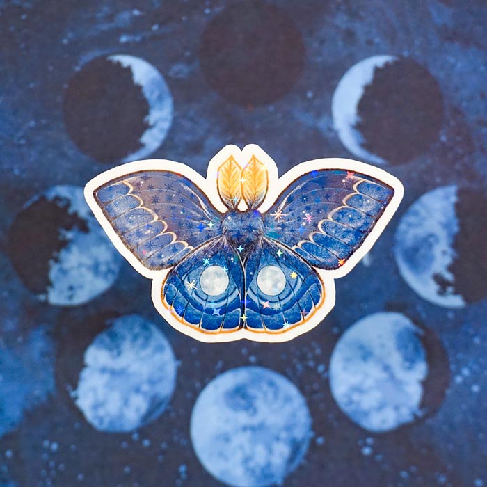 holographic sticker of a full moon moth with a moon background made by atelier persephone