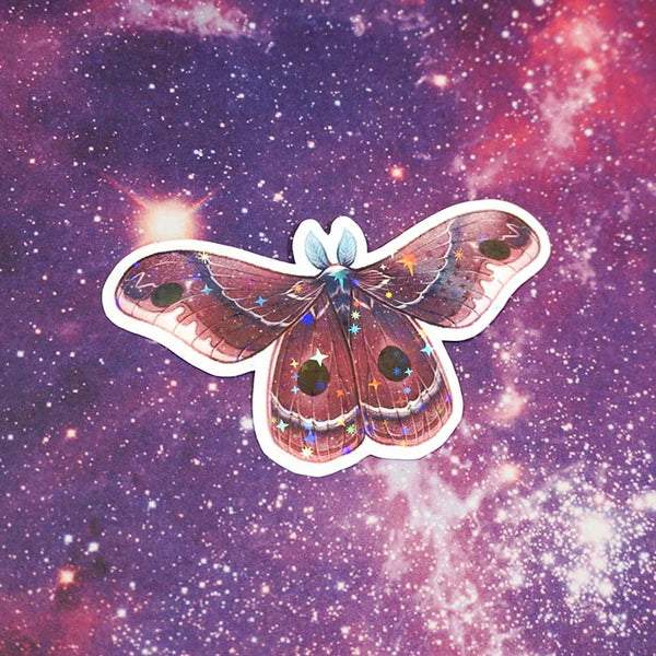 new moon moth sticker on a bright and purple starry sky background created by atelier persephone