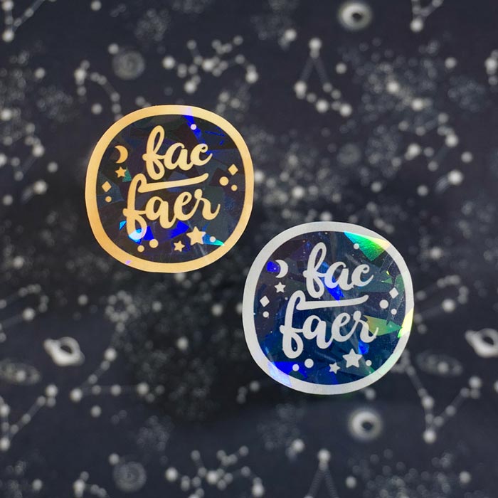 two fae faer holographic stickers on a blurry starry background made by atelier persephone