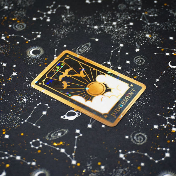 vinyl sticker of judgement tarot card on a starry background