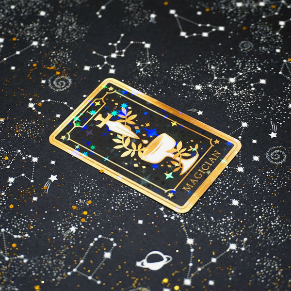 vinyl stickers of the magician tarot card with a stars background