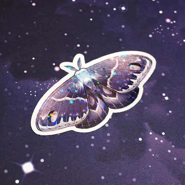 waning gibbous moth aesthetic sticker on top of a starry sky background created by atelier persephone